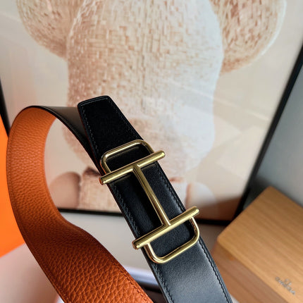HM ROYAL BELT BUCKLE & REVERSIBLE NOIR AND ORANGE LEATHER STRAP 32 MM GOLD HARDWARE