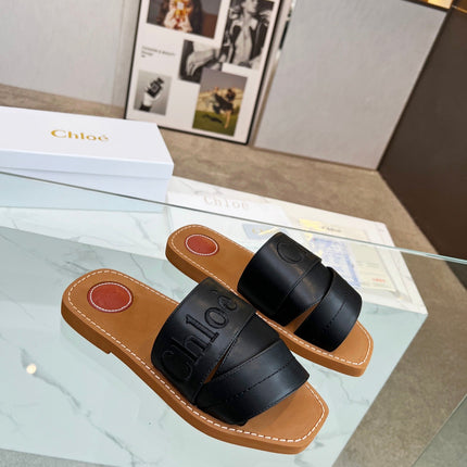 WOODY MULE IN BLACK LAMBSKIN WITH EMBROIDERED LOGO