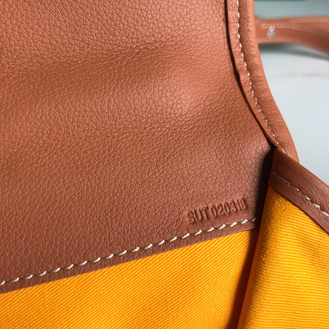 SAINT LÉGER BACKPACK 35 IN BROWN GOYARDINE CANVAS AND CALFSKIN WITH CARTOON PATCH