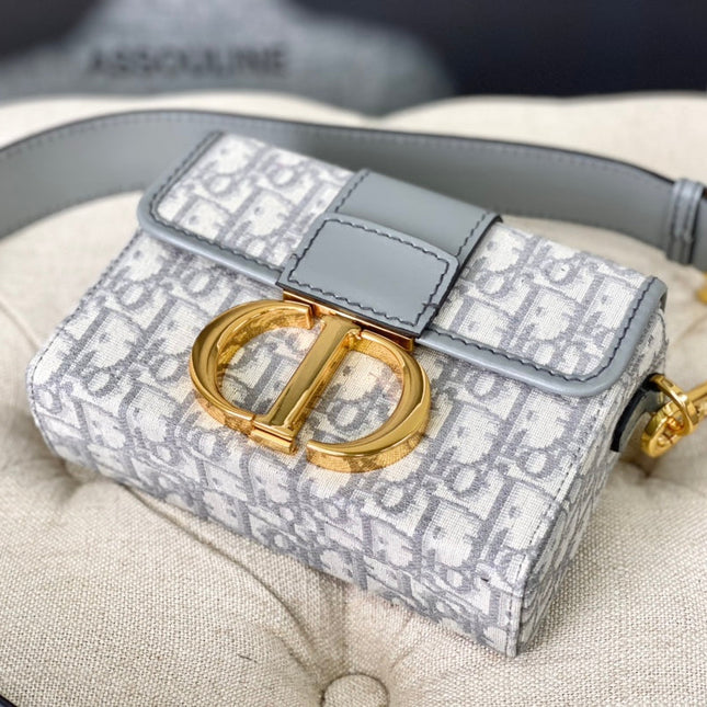 MONTAIGNE 19 HANDBAG IN GREY CALFSKIN