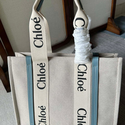 LAGRE WOODY TOTE BAG 45 IN BEIGE LINEN CANVAS BLACK WEBBING LOGO EMBROIDER BLUE CALFSKIN