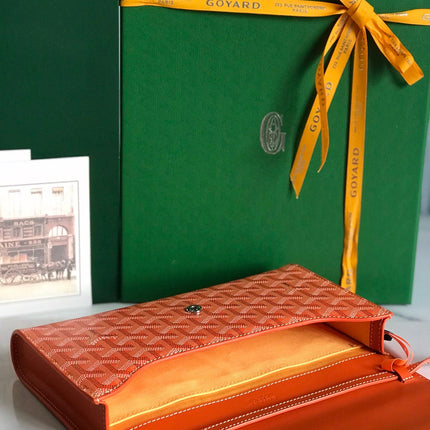 MONTE-CARLO PM CLUTCH 25 IN ORANGE GOYARDINE CANVAS
