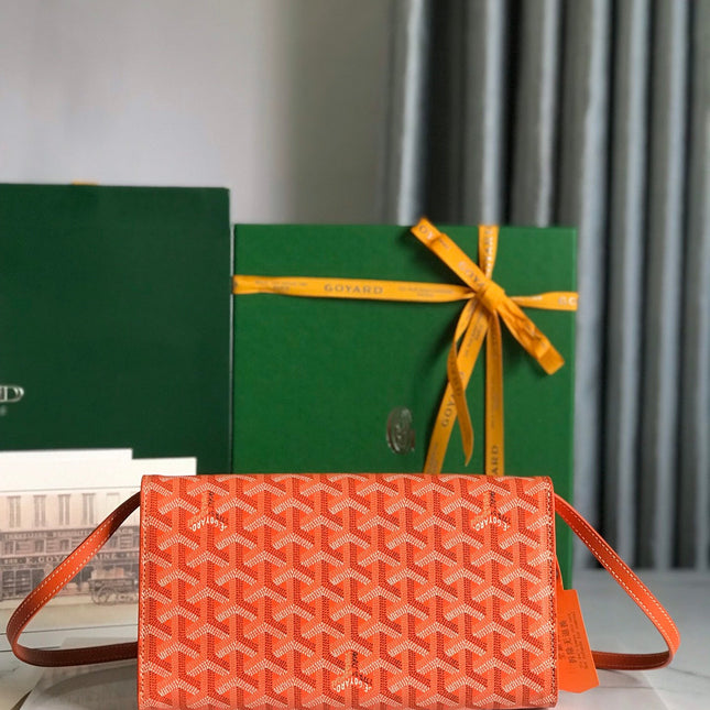 MONTE-CARLO PM CLUTCH 25 IN ORANGE GOYARDINE CANVAS