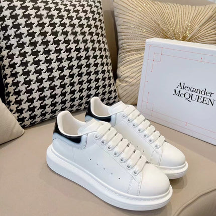 OVERSIZED SNEAKER IN WHITE CALFSKIN WITH GLOSSY BLACK AND WHITE HEEL TAB