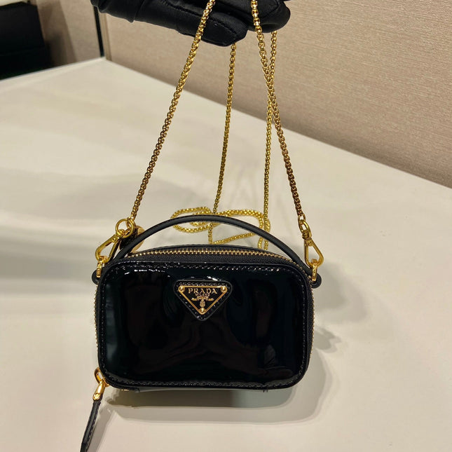 MINI HAND BAG 11 WITH GOLD STRAP IN BLACK PATENT CALFSKIN