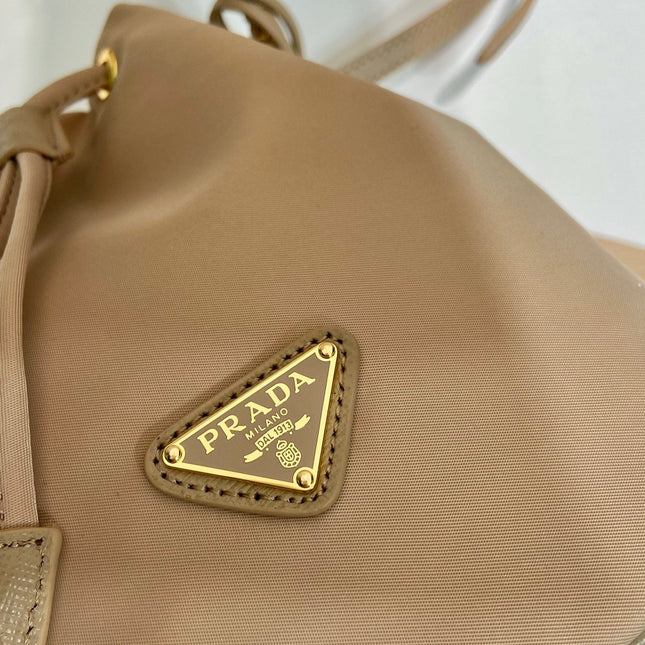 BUCKET BAG 19 IN BEIGE RE-NYLON AND SAFFIANO LEATHER HANDLE