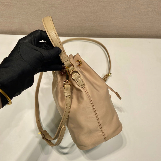 BUCKET BAG 19 IN BEIGE RE-NYLON AND SAFFIANO LEATHER HANDLE