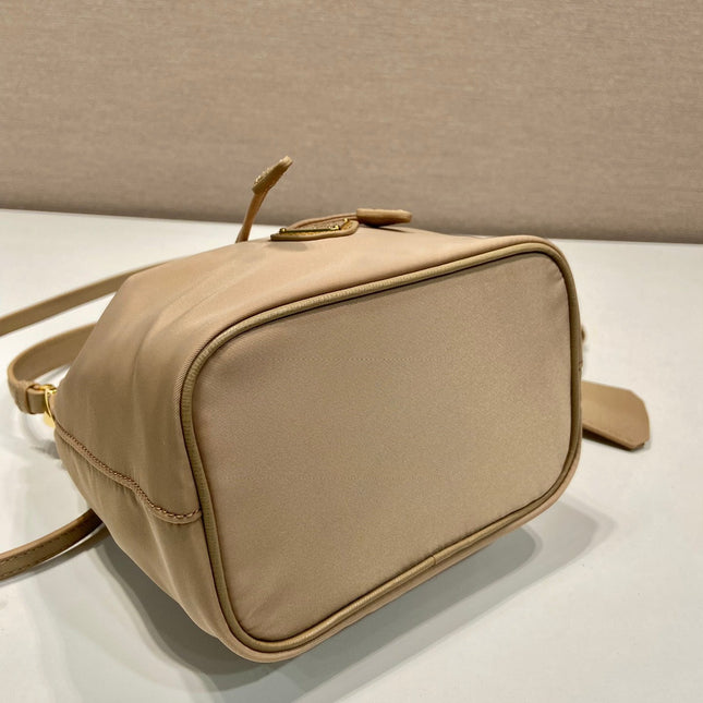 BUCKET BAG 19 IN BEIGE RE-NYLON AND SAFFIANO LEATHER HANDLE