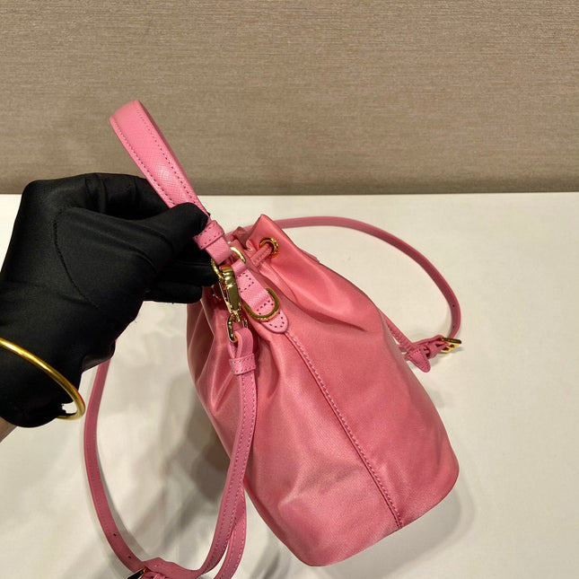 BUCKET BAG 19 IN CANDY PINK RE-NYLON AND SAFFIANO LEATHER HANDLE