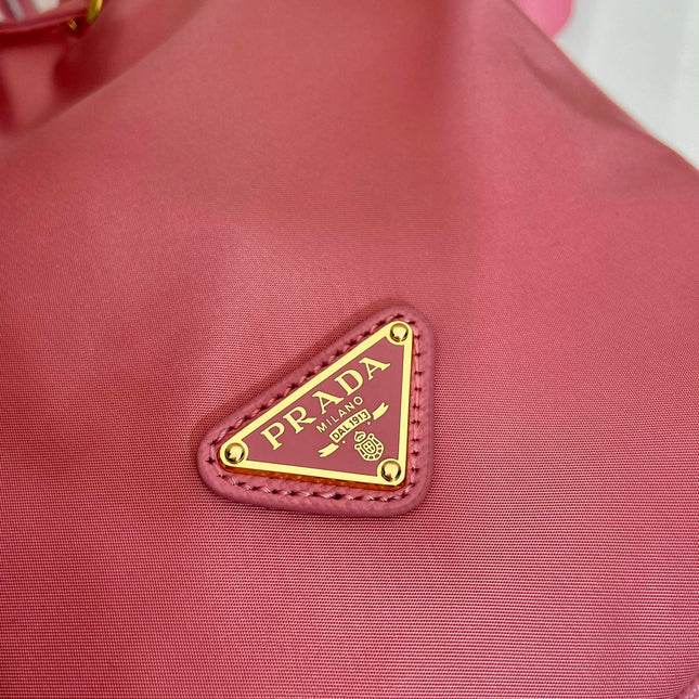 BUCKET BAG 19 IN CANDY PINK RE-NYLON AND SAFFIANO LEATHER HANDLE