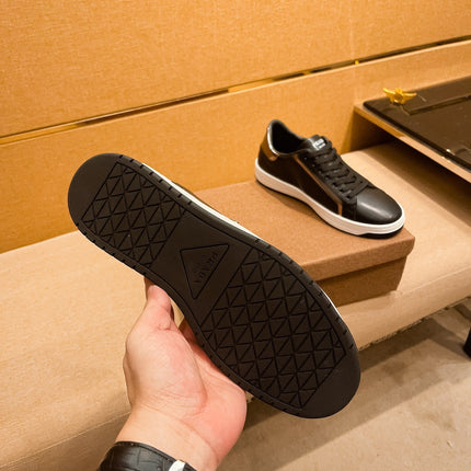 PRA SNEAKER IN BLACK CALFSKIN WITH GLOSSY GOLDEN