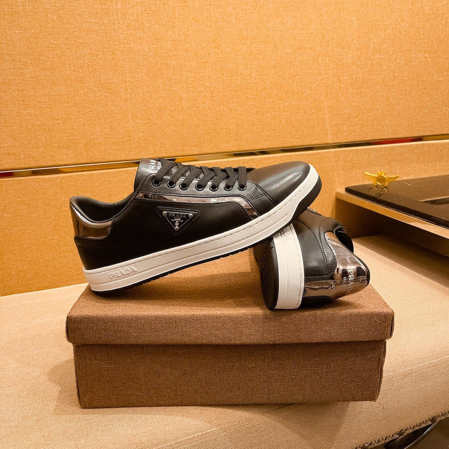 PRA SNEAKER IN BLACK CALFSKIN WITH GLOSSY GOLDEN