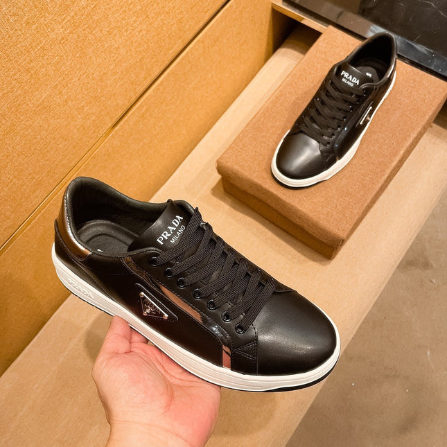 PRA SNEAKER IN BLACK CALFSKIN WITH GLOSSY GOLDEN
