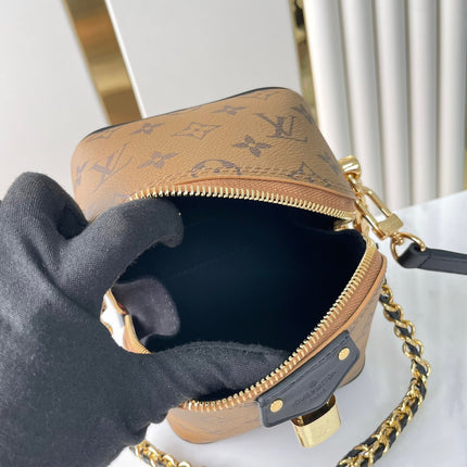 JUST IN CASE 14 IN BROWN MONOGRAM REVERSE CANVAS GOLD HARDWARE