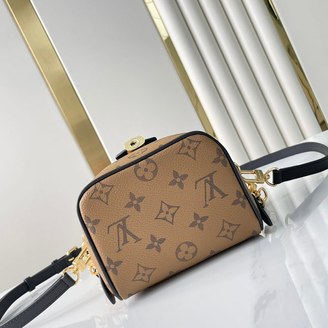 JUST IN CASE 14 IN BROWN MONOGRAM REVERSE CANVAS GOLD HARDWARE