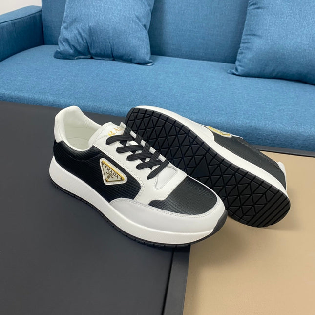 PRA SNEAKER IN WHITE CALFSKIN AND BLACK FABRIC WITH GOLDEN LOGO