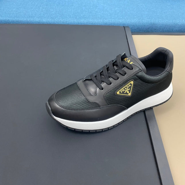 PRA SNEAKER IN BLACK CALFSKIN AND FABRIC WITH GOLDEN LOGO