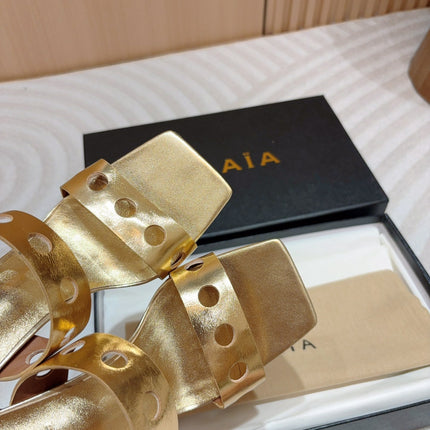 ALAIA TWO-STRAPS HIGH HEEL SANDALS IN GOLDEN PATENT LAMBSKIN