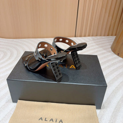 ALAIA TWO-STRAPS HIGH HEEL SANDALS IN BLACK PATENT LAMBSKIN