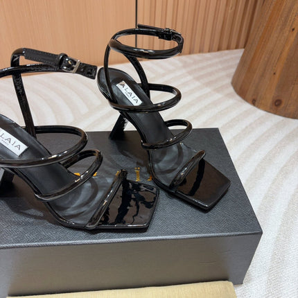ALAIA THREE-STRAPS HIGH HEEL SANDALS IN BLACK PATENT LAMBSKIN