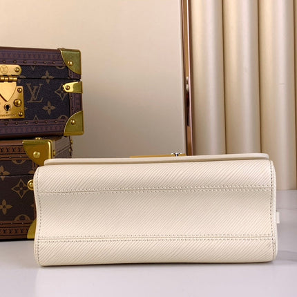 TWIST MM 23 IN QUARTZ WHITE EPI LEATHER GOLD HARDWARE