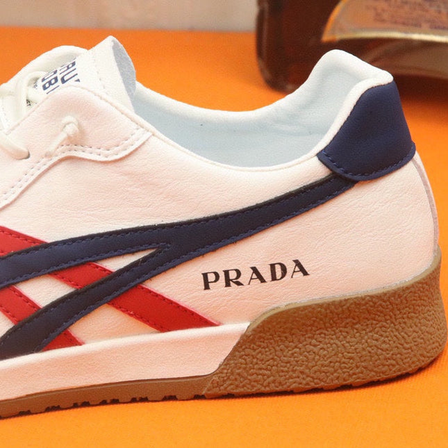 PRA SNEAKER IN WHITE CALFSKIN WITH NAVY BLUE AND RED STRIPED
