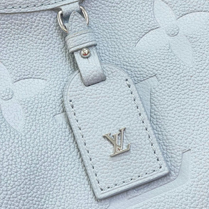CARRYALL PM 29 IN BEAU BLUE MONOGRAM EMPREINTE LEATHER