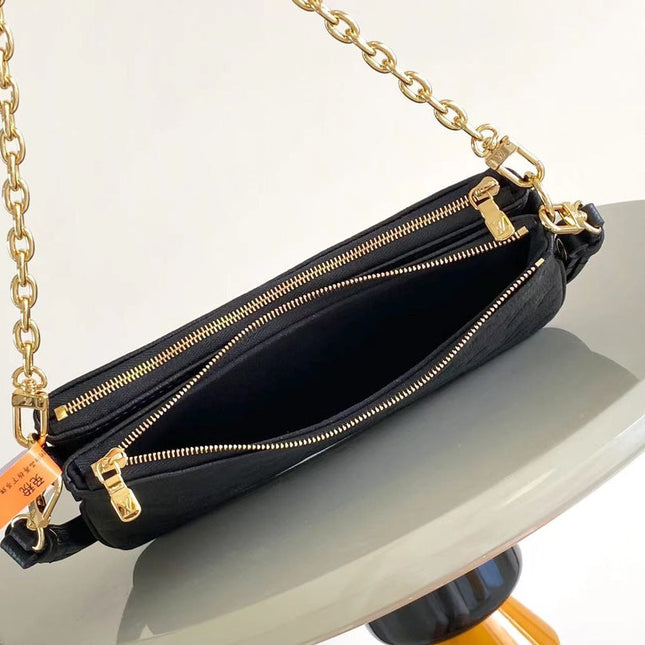 LIV POCHETTE 24 IN BLACK MONOGRAM EMPREINTE LEATHER GOLD HARDWARE