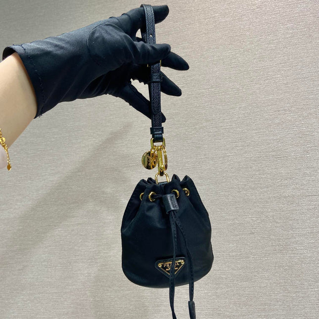 MINI BUCKET BAG 10 IN BLACK RE-NYLON AND SAFFIANO LEATHER STRAP