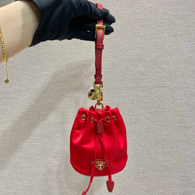 MINI BUCKET BAG 10 IN RED RE-NYLON AND SAFFIANO LEATHER STRAP