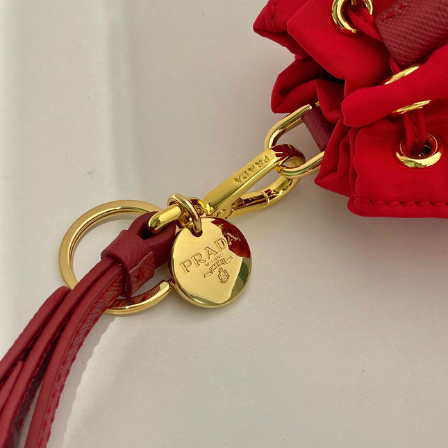 MINI BUCKET BAG 10 IN RED RE-NYLON AND SAFFIANO LEATHER STRAP