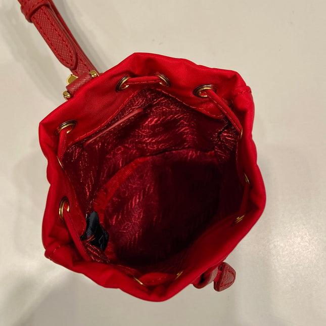 MINI BUCKET BAG 10 IN RED RE-NYLON AND SAFFIANO LEATHER STRAP