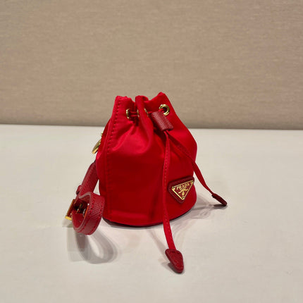 MINI BUCKET BAG 10 IN RED RE-NYLON AND SAFFIANO LEATHER STRAP