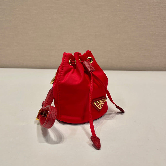 MINI BUCKET BAG 10 IN RED RE-NYLON AND SAFFIANO LEATHER STRAP