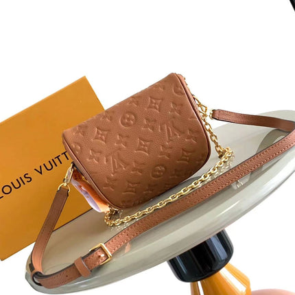 MINI BUMBAG 17 IN COGNAC MONOGRAM EMPREINTE LEATHER GOLD HARDWARE