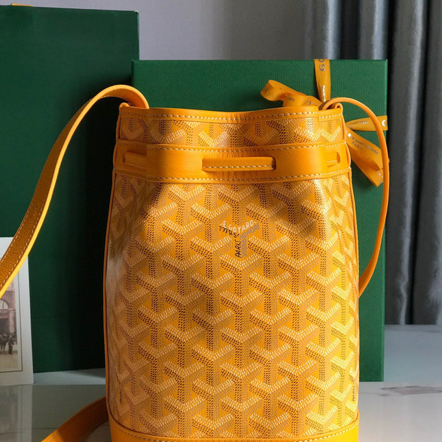 PETIT FLOT BUCKET BAG 22 IN YELLOW GOYARDINE CANVAS AND LAMBSKIN TRIM