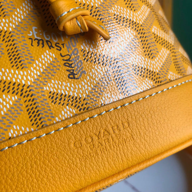 PETIT FLOT BUCKET BAG 22 IN YELLOW GOYARDINE CANVAS AND LAMBSKIN TRIM