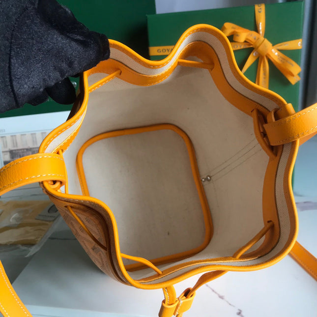 PETIT FLOT BUCKET BAG 22 IN YELLOW GOYARDINE CANVAS AND LAMBSKIN TRIM
