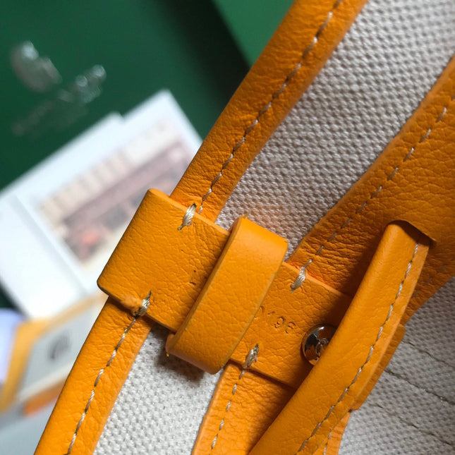 PETIT FLOT BUCKET BAG 22 IN YELLOW GOYARDINE CANVAS AND LAMBSKIN TRIM