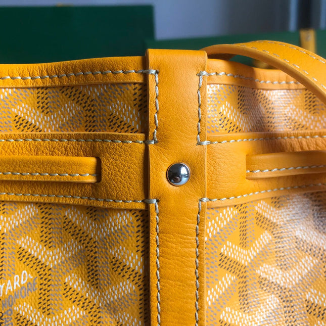 PETIT FLOT BUCKET BAG 22 IN YELLOW GOYARDINE CANVAS AND LAMBSKIN TRIM