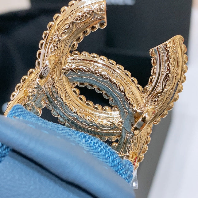 DOUBLE C ELASTIC BELT 30MM IN BLUE DENIM WITH GOLD BUCKLE AND SIDE RHINESTONE DETAILING