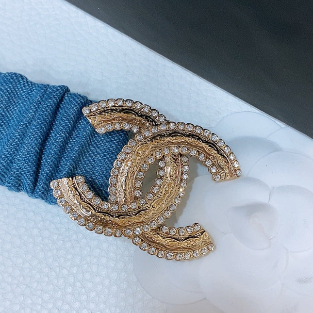 DOUBLE C ELASTIC BELT 30MM IN BLUE DENIM WITH GOLD BUCKLE AND SIDE RHINESTONE DETAILING