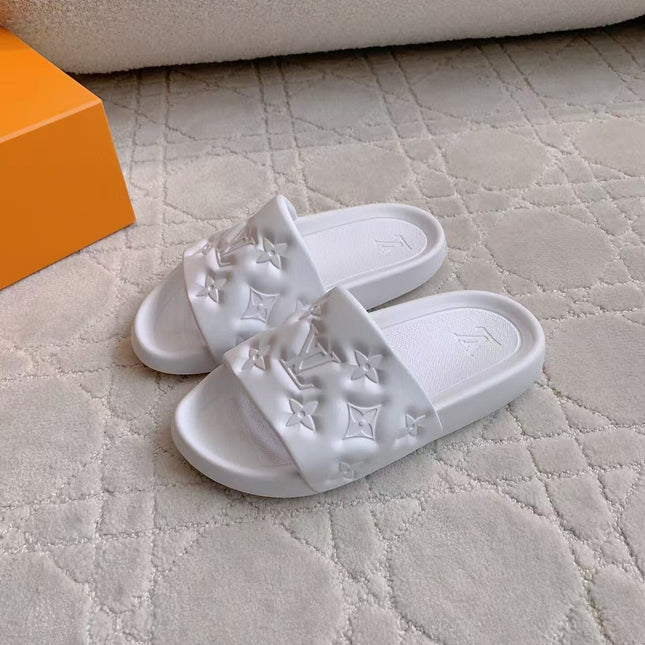 LV EMBOSSED POOL PILLOW SANDALS IN WHITE RUBBER