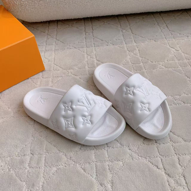 LV EMBOSSED POOL PILLOW SANDALS IN WHITE RUBBER