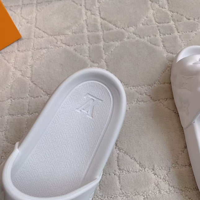 LV EMBOSSED POOL PILLOW SANDALS IN WHITE RUBBER