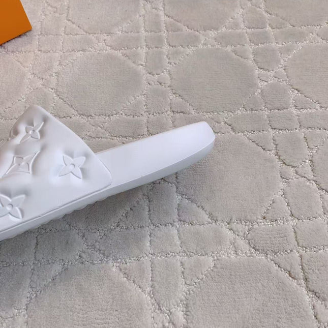 LV EMBOSSED POOL PILLOW SANDALS IN WHITE RUBBER