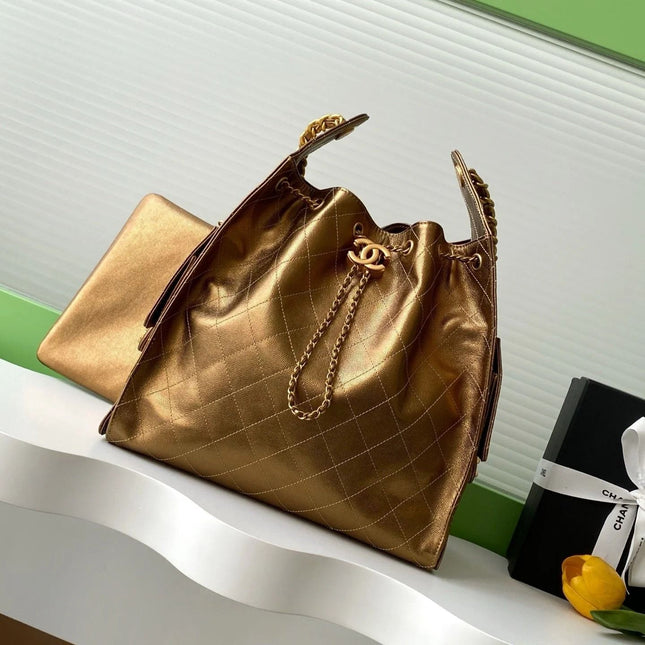 GABRIELLE BUCKET BAG IN METALLIC GOLD LAMBSKIN