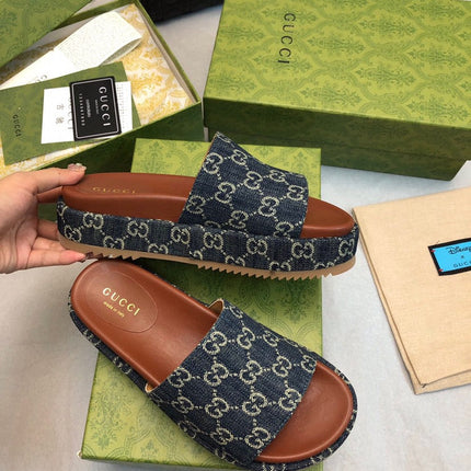 GG THICK PLATFORM SLIDES IN BLUE MONOGRAM EMBOSSED FABRIC