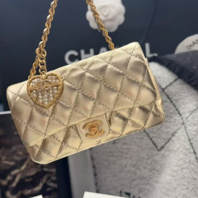 CC CLASSIC FLAP BAG 13 IN GOLD LAMBSKIN WITH PEARL HEART CHARM