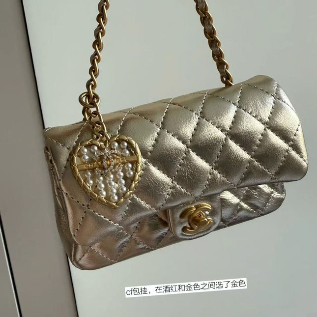 CC CLASSIC FLAP BAG 13 IN GOLD LAMBSKIN WITH PEARL HEART CHARM